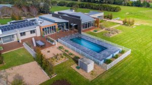 Compass Pool installed partially above the ground